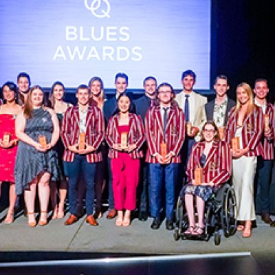 Group of people standing on stage 